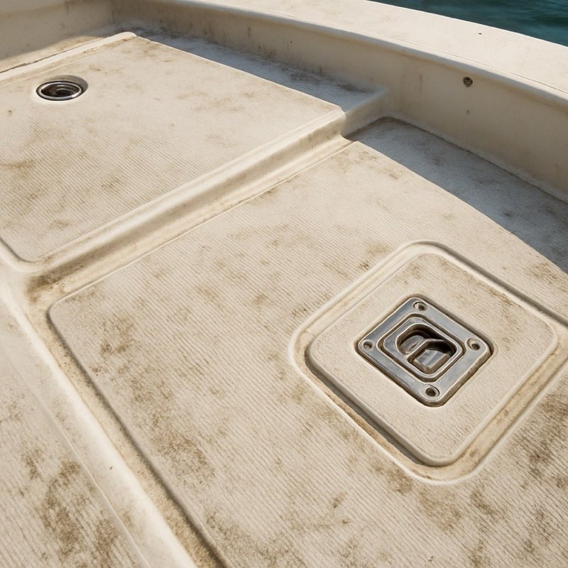 Dirty non-skid deck with ground-in grime before cleaning